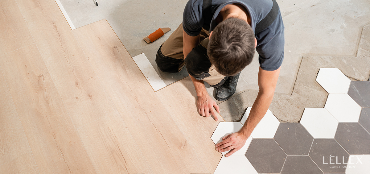 a man lays laminate flooring