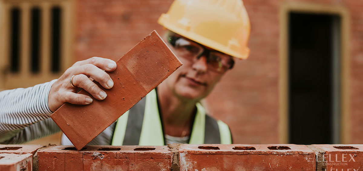 builder with a brick