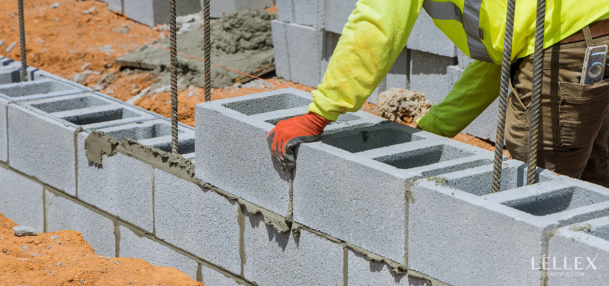 A man masonry a big brick