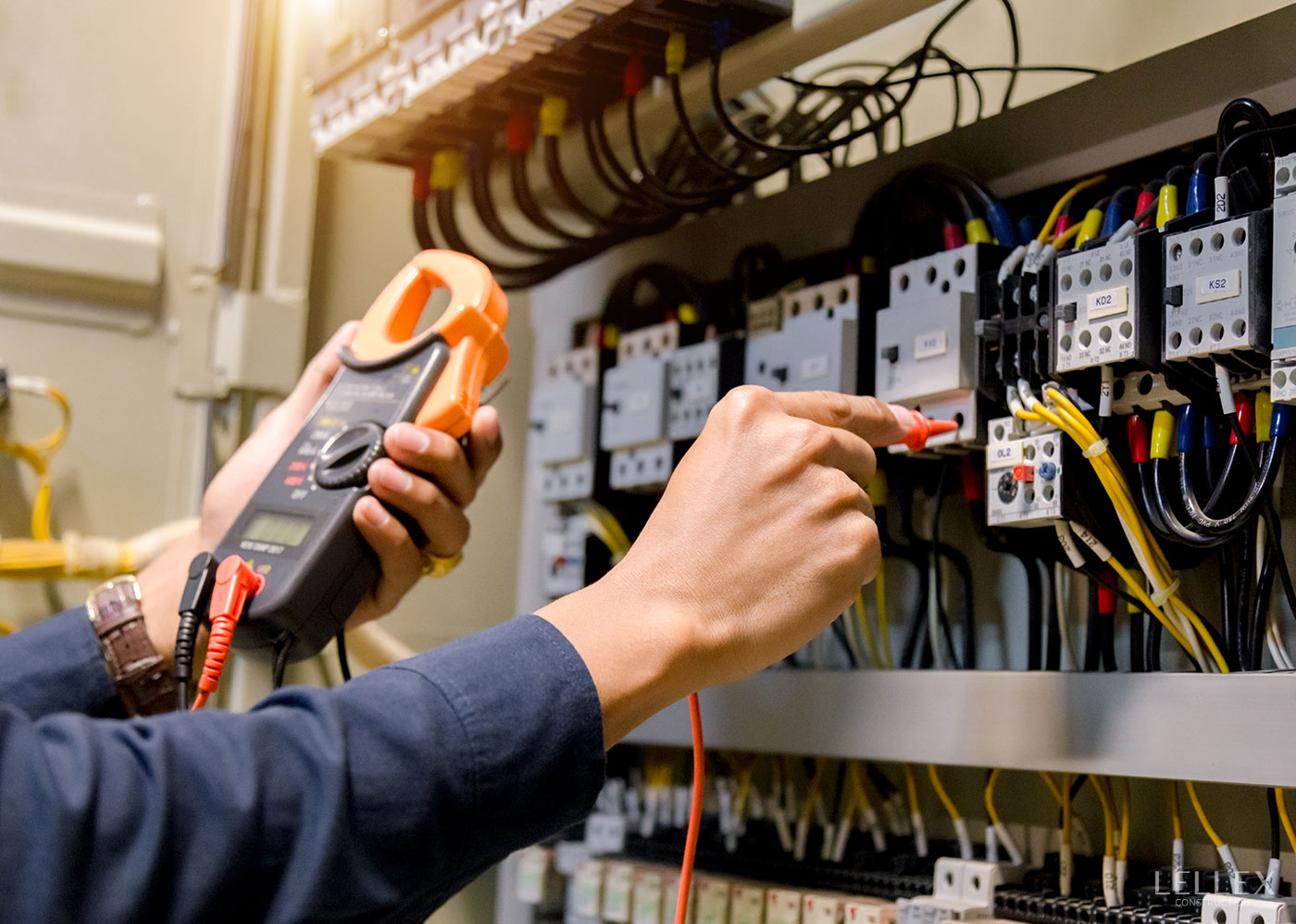 A man checks the voltage in a vending machine