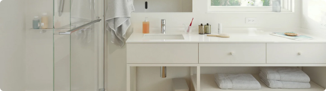 white bathroom with a clear shower